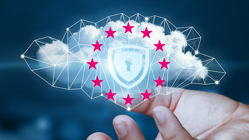 Hand holding a digital cloud with a lock symbol and EU stars, representing cloud security and data protection in Europe.