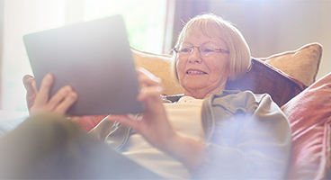 Older woman uses the Brain+ Health app for digital healthcare