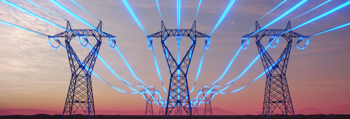 High-voltage power lines with blue light against a colored horizon