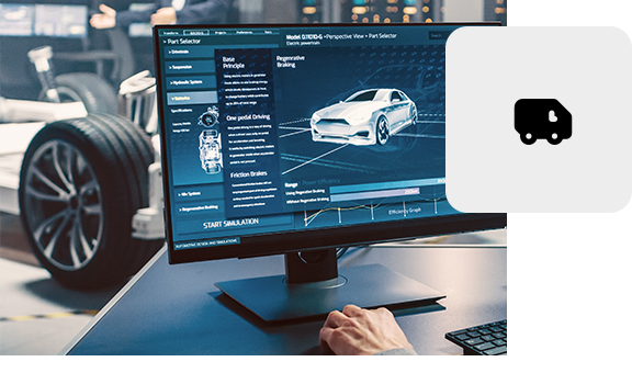 Engineer viewing a 3D vehicle model on a large screen in a design studio.