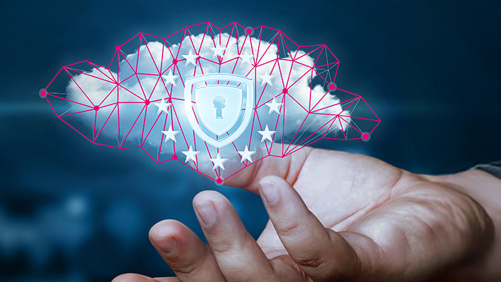 Hand holding a digital cloud with a lock symbol and EU stars, representing cloud security and data protection in Europe.