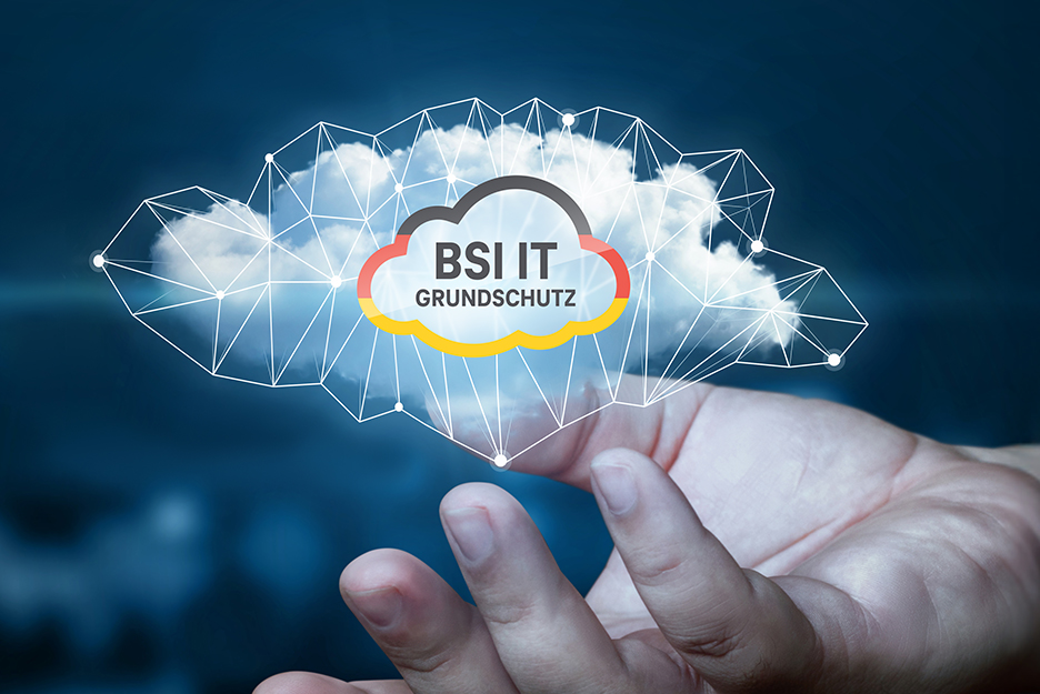 A hand holds a cloud that is connected by a network of lines and dots. In the center of the cloud is the lettering “BSI IT-Grundschutz”.